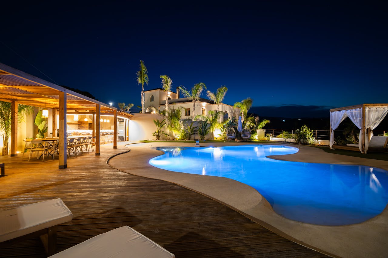 Crafting Captivating Headlines: Your awesome post title goes here Experience luxury in a Mediterranean villa poolside at night, perfect for relaxation.